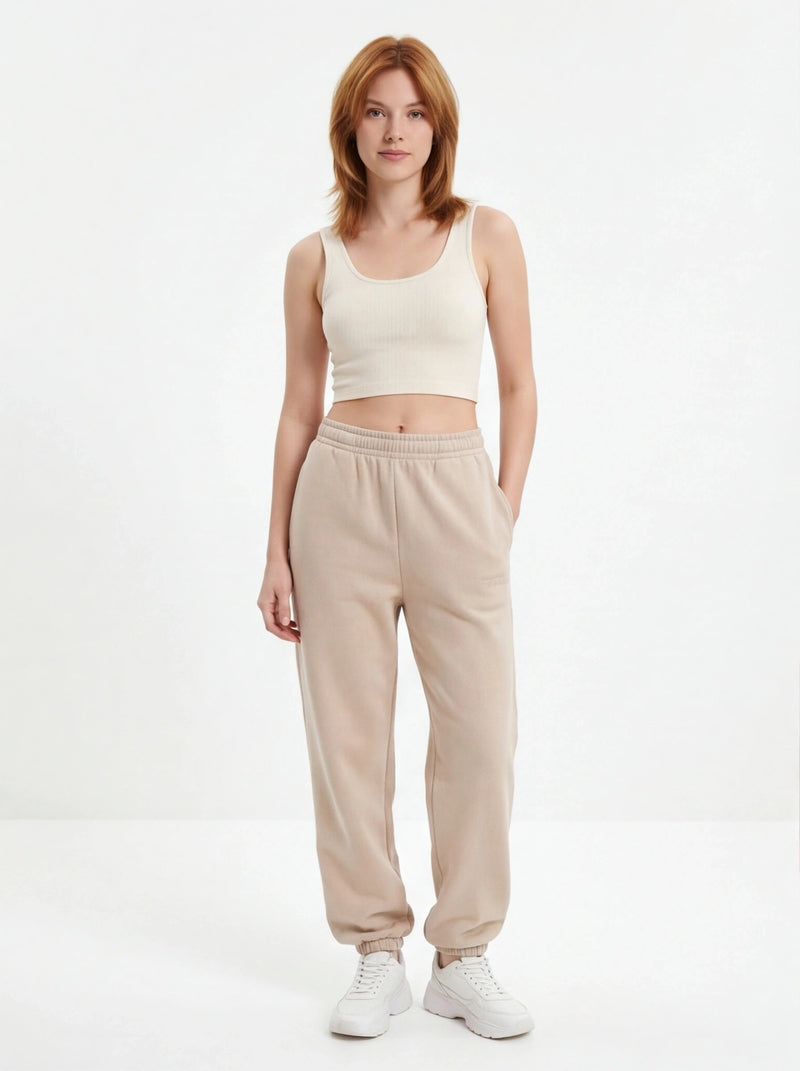 Damskie spodnie dresowe oversize UNLEASH WINGS BEIGE