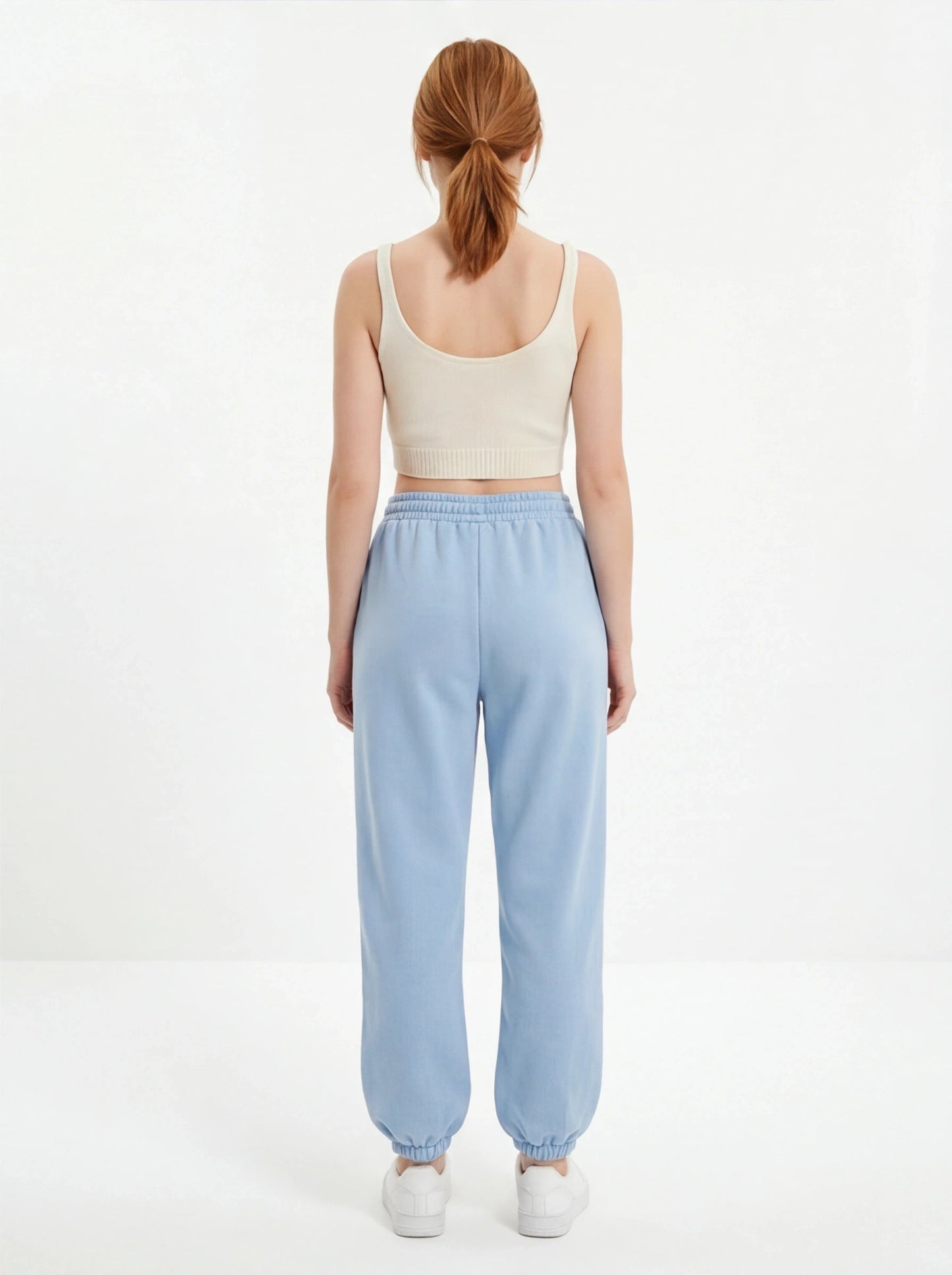 Damskie spodnie dresowe oversize UNLEASH WINGS PASTEL BLUE WINGS UNLEASH