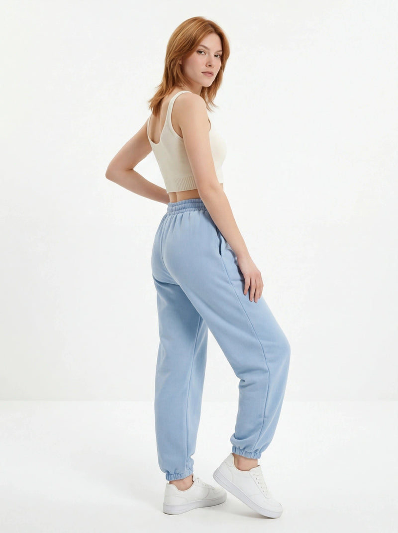 Damskie spodnie dresowe oversize UNLEASH WINGS PASTEL BLUE