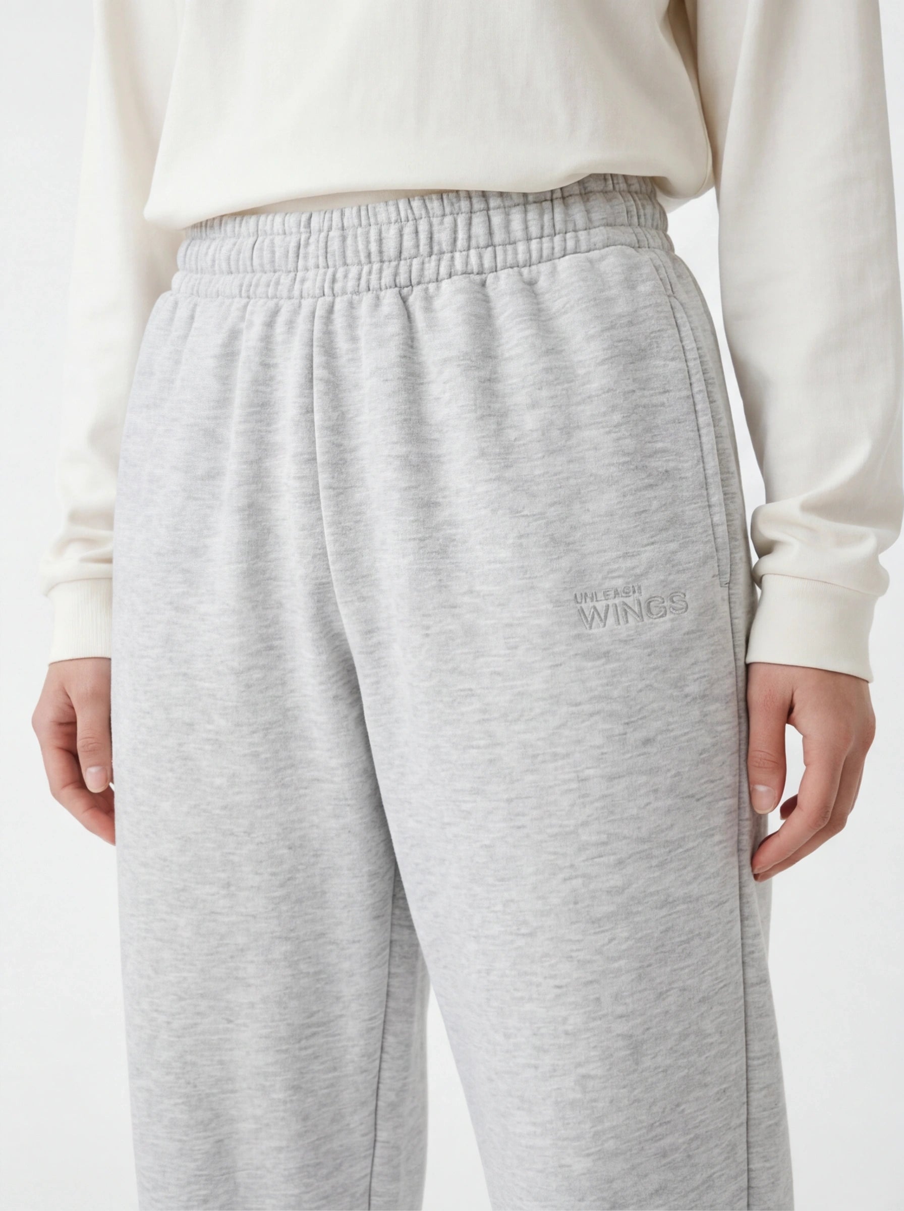 Damskie spodnie dresowe oversize UNLEASH WINGS GREY WINGS UNLEASH