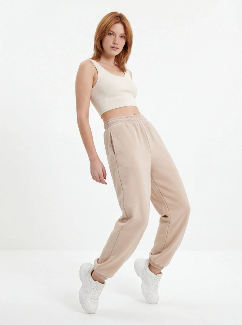 Damskie spodnie dresowe oversize UNLEASH WINGS BEIGE